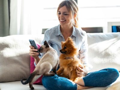 beautiful-woman-playing-with-her-cute-dog-and-cat-2021-08-30-05-21-59-utc-1200x800